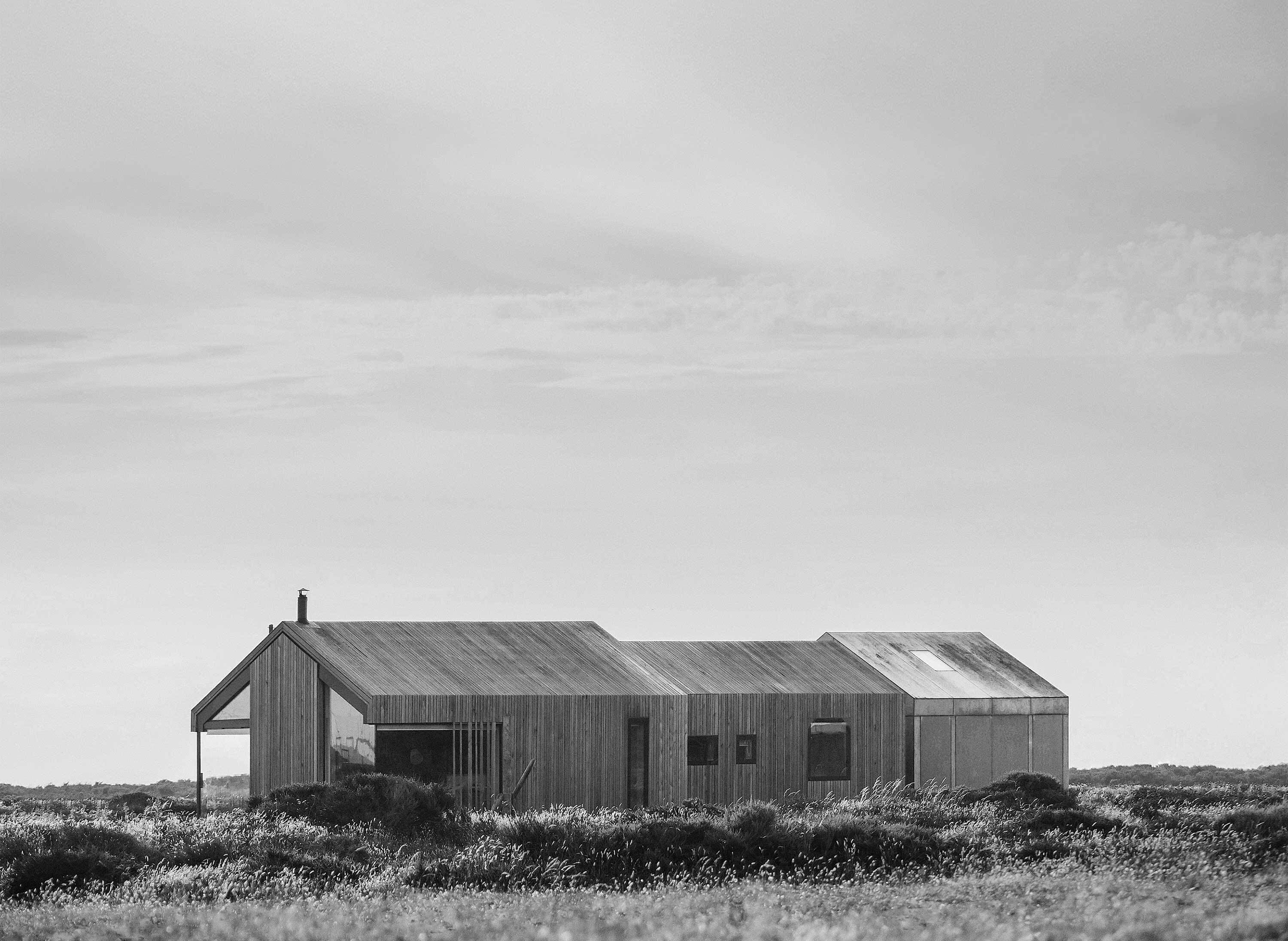 A timber residence set in a windswept landscape